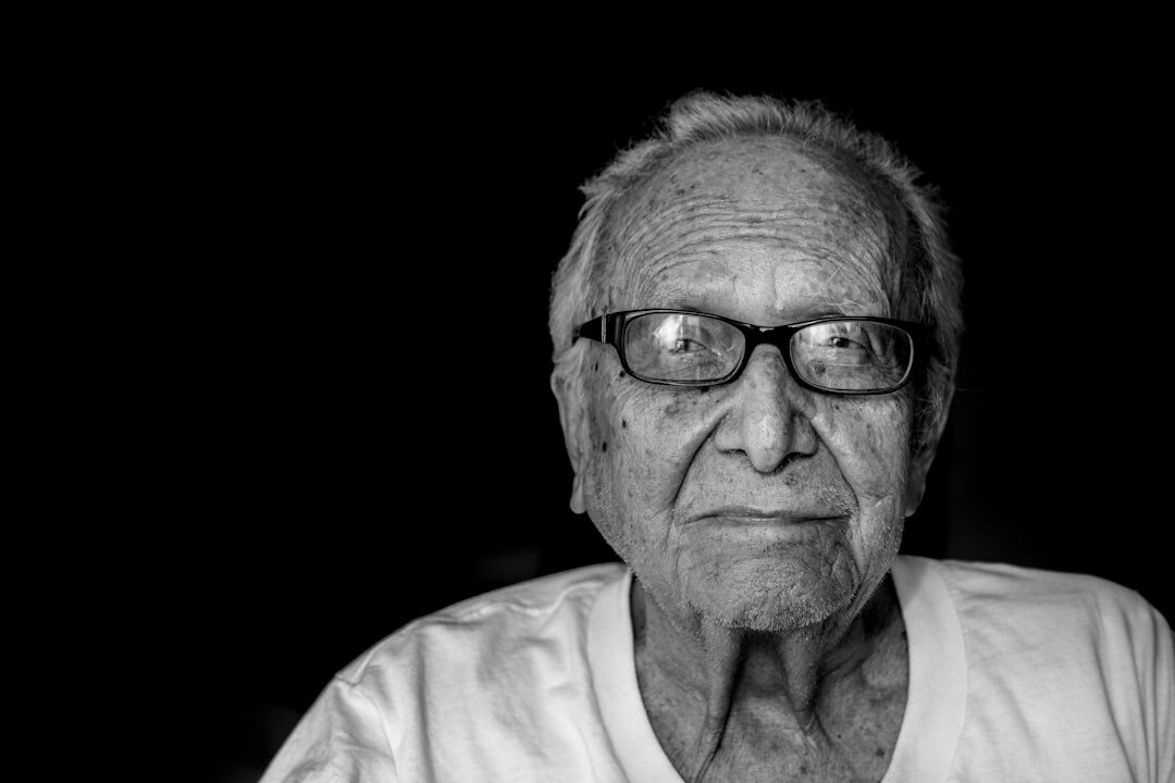 Portrait of a friendly senior man with glasses