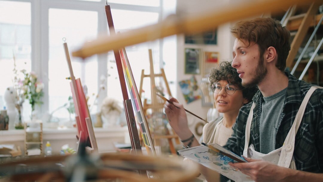 Seniors painting together in an art workshop